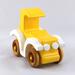 A handmade wooden toy car vintage style coupe painted nontoxic bright yellow and white with spoked wheels finished with nonmarring amber shellac from my  Bad Bobs Custom Motors Collection.
