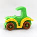 A handmade wooden toy car vintage style coupe painted nontoxic bright green and yellow with spoked wheels finished with nonmarring amber shellac, from my  Bad Bob's Custom Motors Collection.