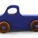 Handmade wood toy truck painted blue with metallic sapphire blue trim and nonmarking amber shellac wheels from my Play Pal Collection.