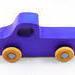A handmade wooden toy pickup truck painted with bright blue and metallic sapphire blue paint. The wheels are finished with non-marring amber shellac. This toy is part of my Play Pal Collection.