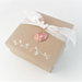 Photo of draft color gift box with muslin ribbon and copper charm, included in sale