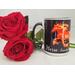 Picture of coffee mug with horse made of flames on a black background.
