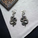 Silver Resin snake earrings. Completed with silver finish hypoallergenic ear wires.