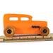 Handmade wooden toy car: hot rod '32 Sedan painted in high gloss Pumpkin Orange with black trim and non-marring amber shellac wheels.