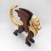 Handmade wood dragon figurine made from select grade contrasting hardwoods and hand-finished with a custom mixture of mineral oil and waxes.