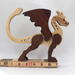 Handmade wood dragon figurine made from select grade contrasting hardwoods and hand-finished with a custom mixture of mineral oil and waxes.