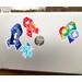 A silver laptop is shown with a 4 1/2 inch word cloud MECFS ribbon compared to a 3 1/2 inch watercolor CRPS and word cloud autism ribbon and a 2 1/2 inch word cloud POTS sticker.