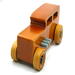 This handmade wooden toy car is based on a 1932 Ford Sedan Hot Rod. It is hand-finished with multiple coats of amber shellac and trimmed with black and grey acrylic paint.