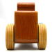 This handmade wooden toy car is based on a 1932 Ford Sedan Hot Rod. It is hand-finished with multiple coats of amber shellac and trimmed with black and grey acrylic paint.