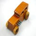 This handmade wooden toy car is based on a 1932 Ford Sedan Hot Rod. It is hand-finished with multiple coats of amber shellac and trimmed with black and grey acrylic paint.