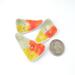 photo showing three abstract triangle copper enamel buttons with yellow, orange, and olive green torch fired enamel on copper - shown with quarter for size relationship