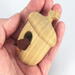 Handmade Wood Birdhouse Ornament Collectable Christmas Tree Ornament shapeed like a Christmas tree. Made from select-grade hardwoods, hand-sanded, and finished with a custom blend of oils and waxes using traditional woodworking tools.