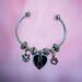Cat memory bracelet with an urn for cremation ashes.
