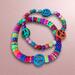 Hippie colorful peace bracelet. Handmade on a stretch cord.