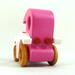 Handmade wooden toy car model-t sedan finished with hot pink and white acrylic paint with nonmaring amber shellac coated spoked wheels from my Bad Bob'S Custom Motors Collection.