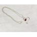 Wire wrapped garnet and sterling silver heart necklace.