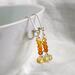 Stacked faceted citrine and gradated Hessonite garnet earrings with sterling silver accents and lever backs.