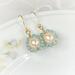 Peach pearl and aqua apatite wire wrapped earrings with 14K gold filled ear wires.