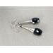 Elegant faceted black spinel earrings with sterling silver cones and ear wires.