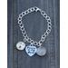 Silver link bracelet with three charms - round Golden Retriever dog photo, Forever in my Heart heart-shaped, and round hair locket. 