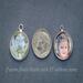 Size comparison of two photo charms next to a dime, one personalized with a name, and one without. 