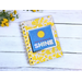 A blank journal or notebook with yellow lined paper and has yellow flowers on the cover and says don't be afraid to shine. 