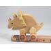 Handmade wooden push toy Triceratops dinosaur made from select grade hardwoods and finished with a non-toxic coating.