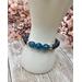 This stretch bracelet combines blue dyed quartz and porcelain beads. This bracelet is about 6 and a half inches.