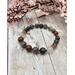 7 inch stretch bracelet comprised of African bloodstone beads, which is a deep, earthy green, often with varying shades and intensity.