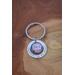 Silver photo key chain featuring older woman's photo encircled by Forever in My Heart accent charm on neutral wood background.