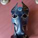 This is a handmade leather mask depicting The Egyptian God Anubuis/ Inpu / Anpu / Black Jackal. This leather mask was hand formed, dyed & painted by us in our shop. The mask features an Ancient Egypt motif including the Eye of Horus and Ankh in addition to depicting Anubis. It has been hand dyed in an antiqued black leather finish and hand painted in gold & Egyptian blue metallic tones. Shown on manequinn head for size and fit reference.
