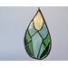 Spring Awakens Stained Glass Drop, featuring 12 pieces of hand-cut glass in spring greens and yellow, on a neutral background