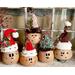 Here is a group of handmade Christmas gourds. Each elf has a custom hat and a cute elf facial expression carved out of their gourd shell. 