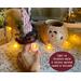 This image shows the battery-operated candle included in your purchase. The candle lights up the carved elf face and has a timer setting.