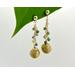 Green tourmaline gems and eco-friendly golden grass bead make these dangle earrings unique and elegant. 2 3/4 long, gold plated.