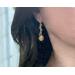 Model using Green tourmaline gems and eco-friendly golden grass dangle earrings.