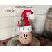 This is a handmade Christmas Santa Claus elf made with a real dried gourd. Including his elf hat, he is 12 inches tall and 4.5 inches wide. 