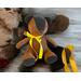 brown suede bear with fleece and yellow ribbon