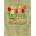 Tulilps behind wooden shoes on olive colored towel