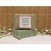 Handmade Rosemary Peppermint soap bar. Fresh peppermint leaves throughout the soap. Wrapped in a brown burlap ribbon, and labeled.