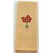 Butter colored towel with red flowers on it.