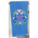 Blue towel with pink flowers and saying on it