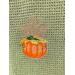 Pumpkin and Stock of Wheat on Olive Towel