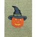 Pumpkin with Black hat on Olive colored towel