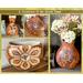 This image shows a collection of gourd vases I have made. Each vase is a warm brown and features wood-burned artwork. 