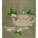 Tea Cup and Tea Pot on green mist towel