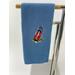 Blue towel with golf bag and golfing items