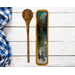 A western themed olive wood spoon rest set with a resin artwork depicting a bronc rider and the Wyoming logo with 24K gold and teal accents.