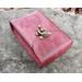 This is a Premium Handmade Leather Tarot Card Case. The star of this tarot deck box is the uniquely hand dyed leather with luscious swirling shades of berry. view showing top flap of tarot pouch.