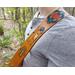This is a Handmade Leather Guitar Strap Featuring an Ancient Egyptian motif. Crafted from ultra thick premium vegetable tanned leather, the instrument strap has been hand dyed and tooled, and the details have been hand painted.

Selected portions of the artwork are hand painted in shades of gold, turquoise, red and blue, and the strap was hand dyed in a distressed Antique Tan with a vintage antique appearance.